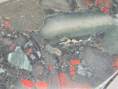 Close-up of a Dark stone African Bloodstone slab with red and gray patterns