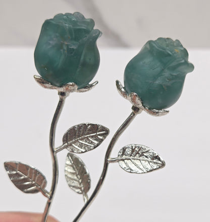Green Fluorite crystal roses mounted on silver stems.