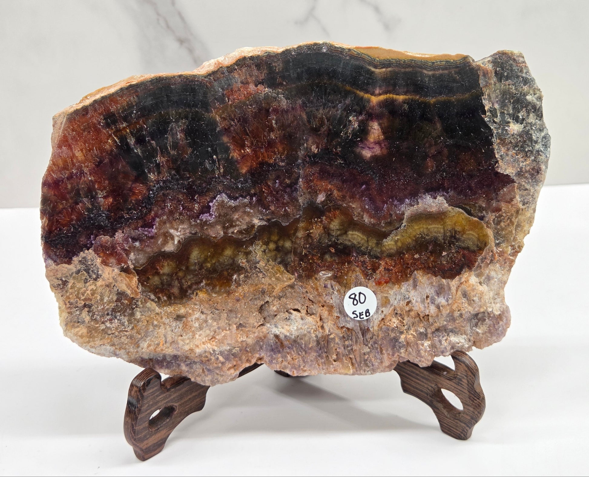 Mineral sample on a stand with a white background