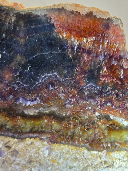 Close-up of a mineral sample with layered colors
