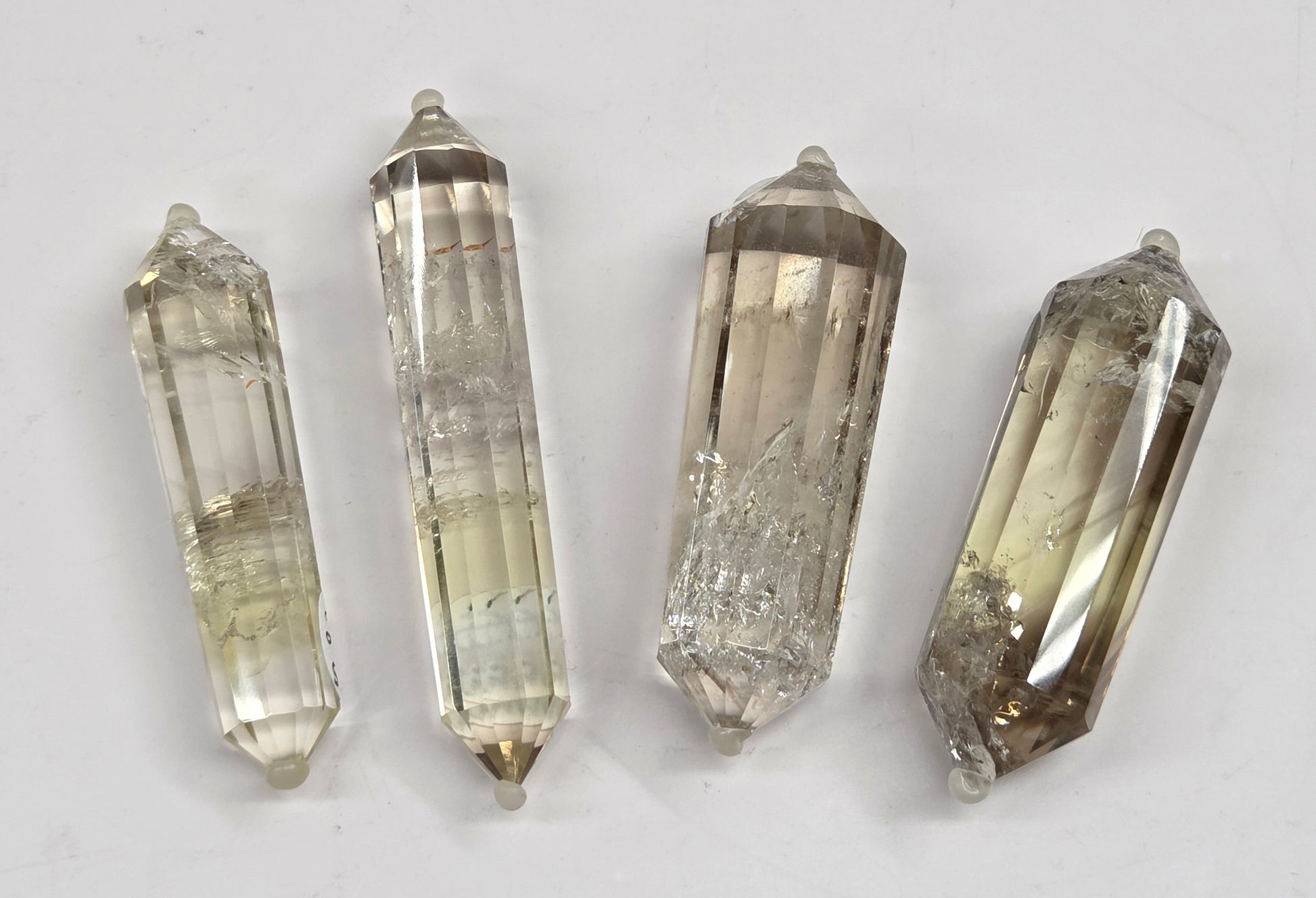 Quartz points on a light gray background