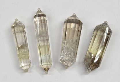 Quartz points on a light gray background