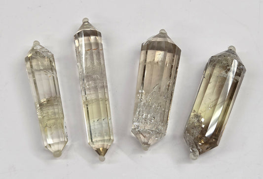 Quartz points on a light gray background