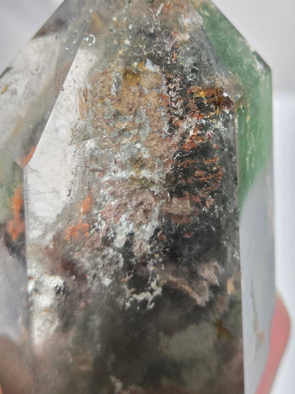 Close-up of a Garden Quartz crystal with visible imperfections and rough surface
