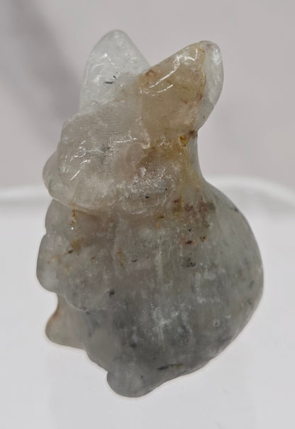Small rabbit garden quartz crystal carving on a white background