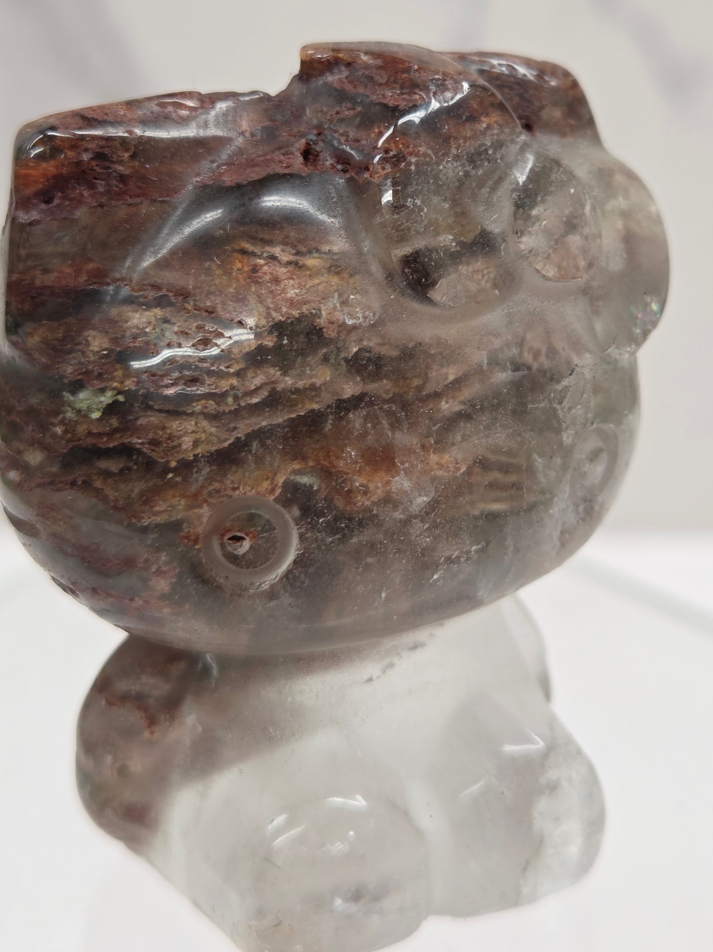 Hello Kitty garden quartz crystal carving on a white background
