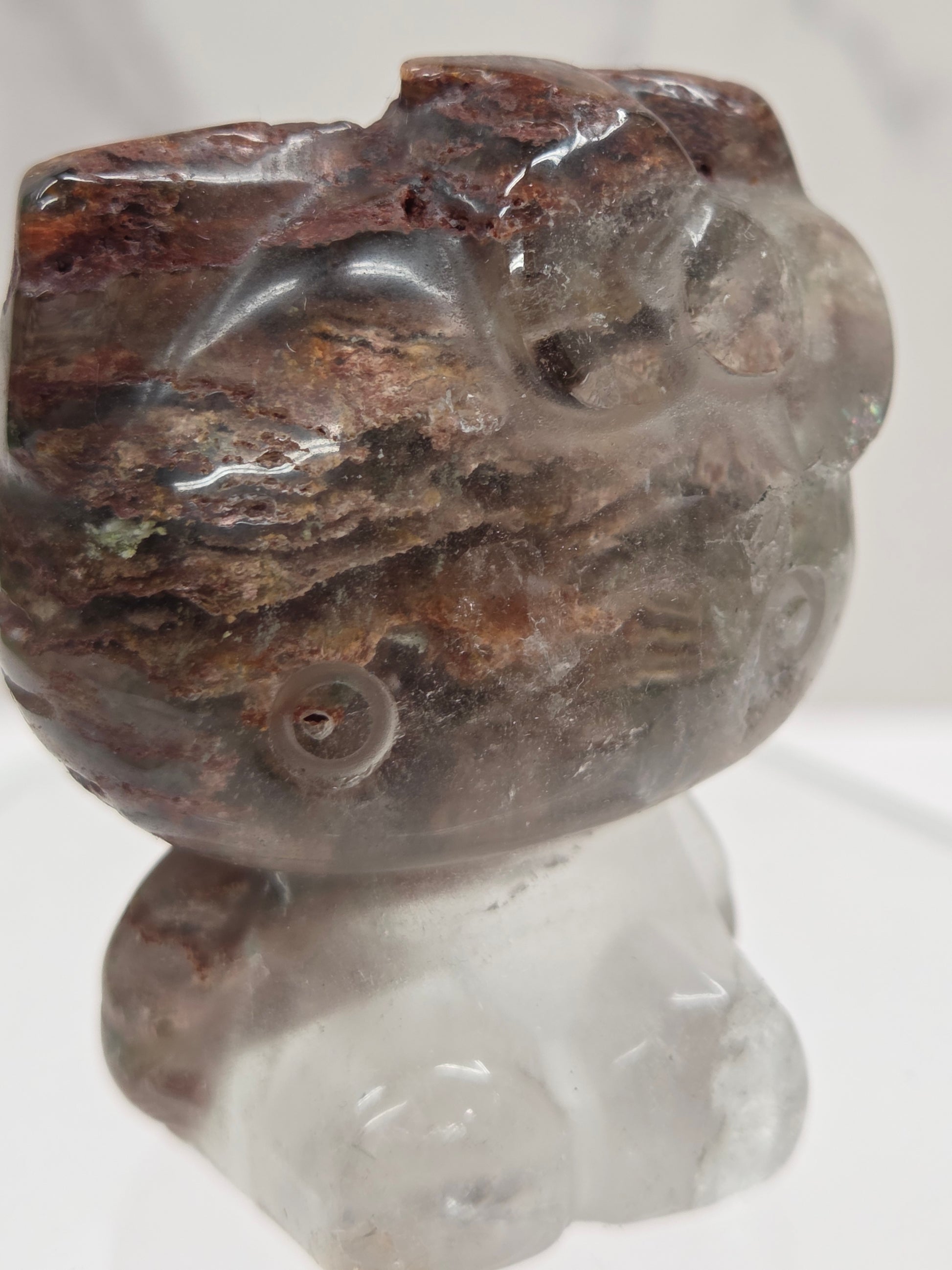 Hello Kitty garden quartz crystal carving on a white background