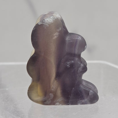 Fluorite crystal fairy carving on a white background