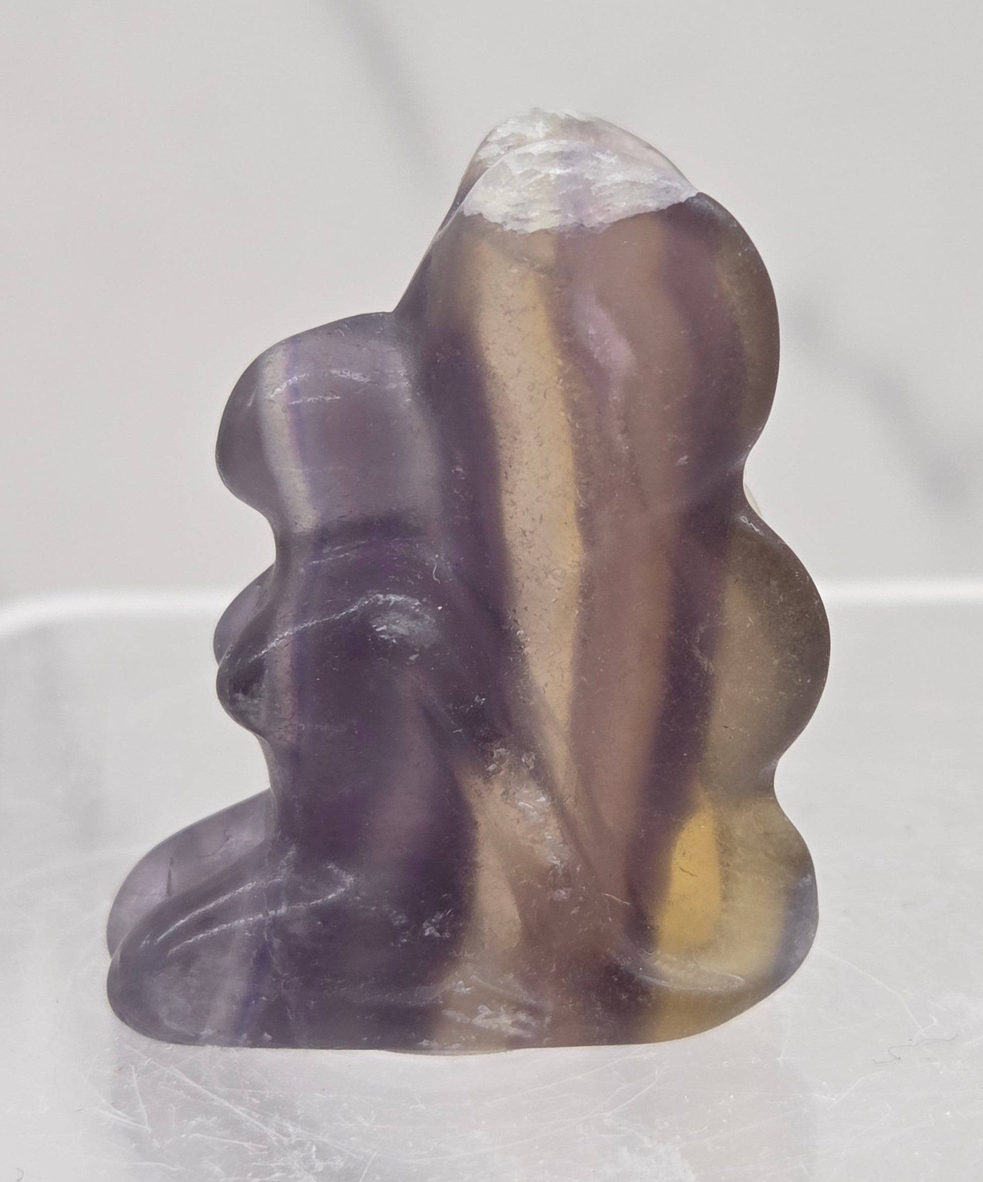 Fluorite crystal fairy carving on a white background