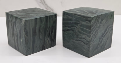 Set of 2 green wave picture jasper cubes with a wave like pattern, on a white background