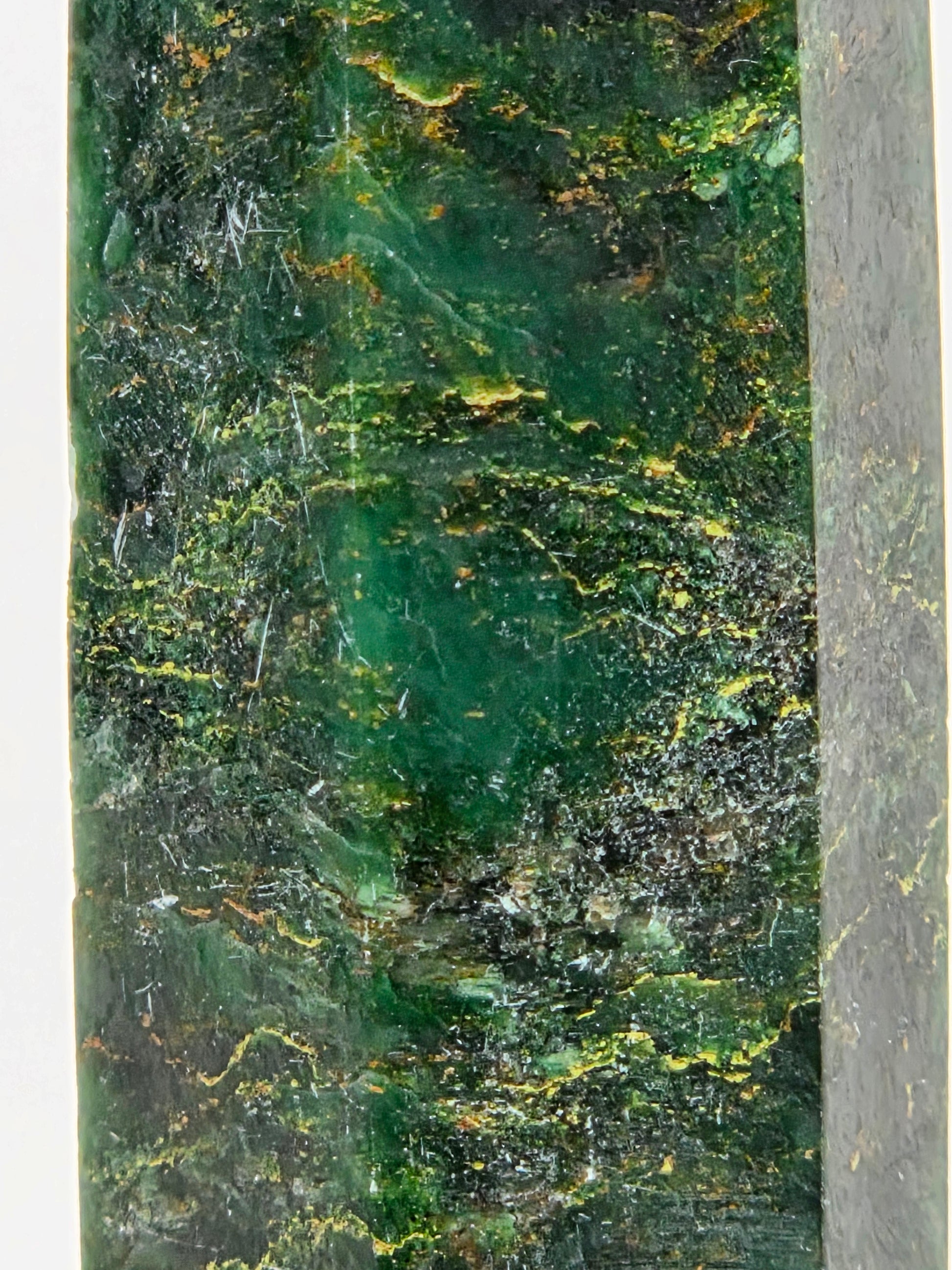 Close-up of an emerald tower with yellow and black inclusions