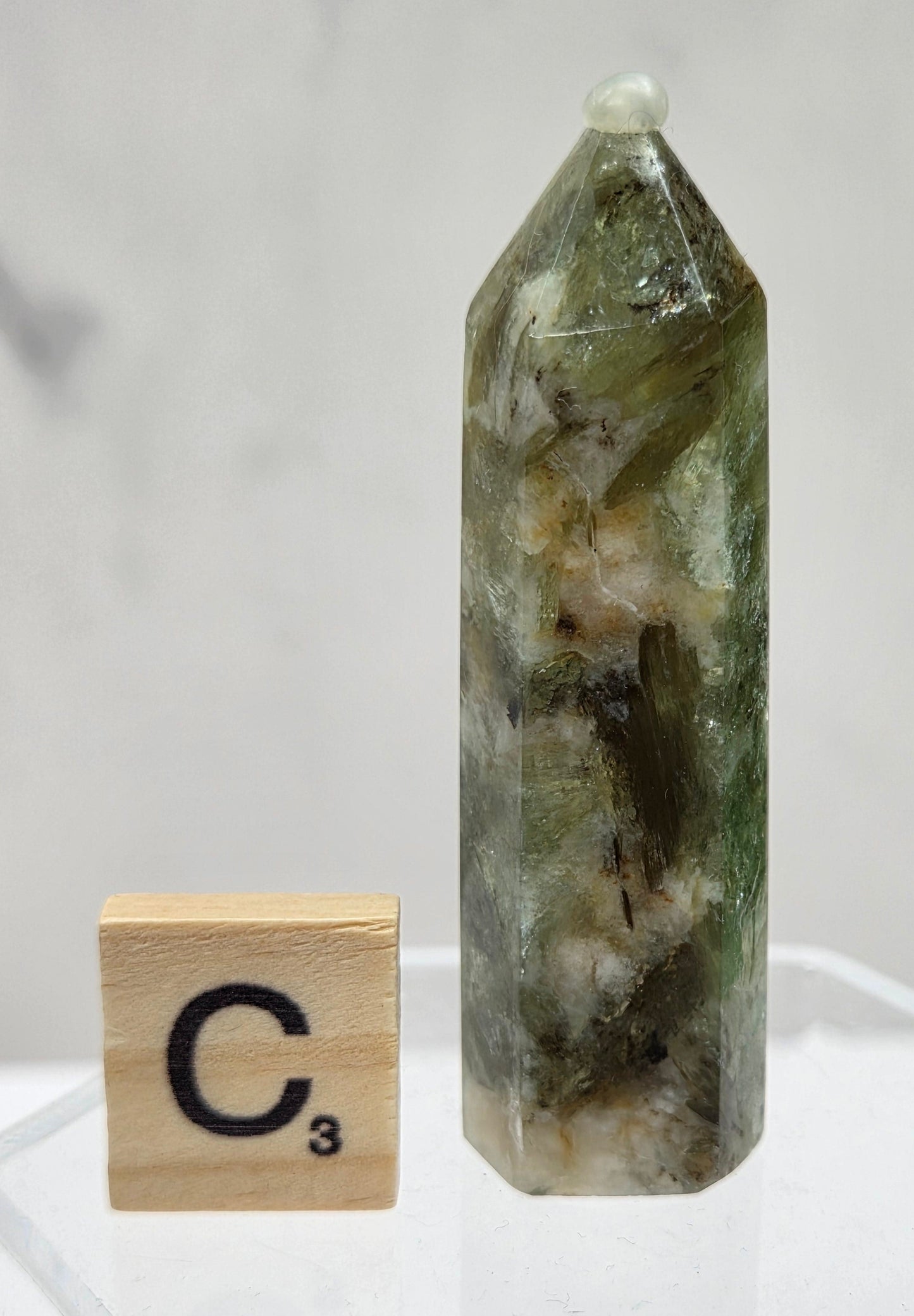 Crystal tower with a wooden block labeled 'C3' on a white background