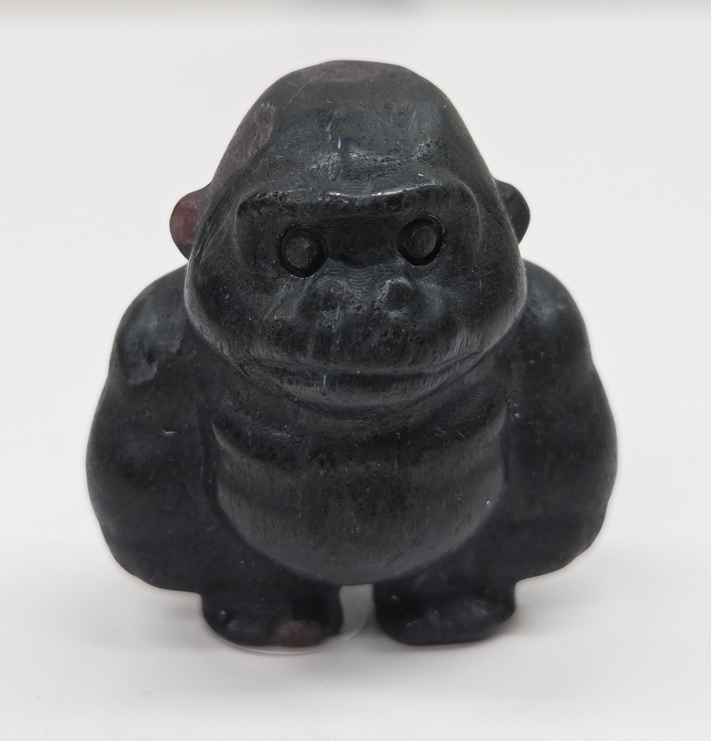 Black Garnet gorilla figurine on a white background