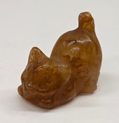 Cat-shaped carvings in Golden Healer, displayed against a white background.