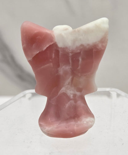 Small Pink Opal angel carving on a white background