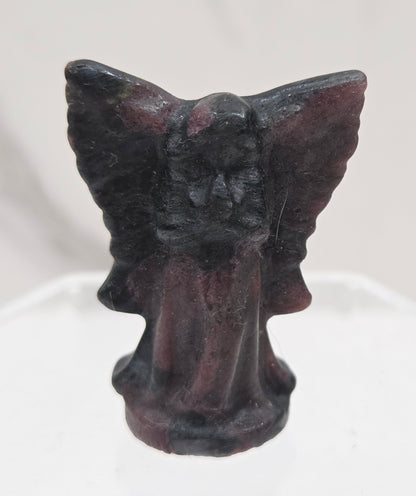 Small Garnet angel carving on a white background