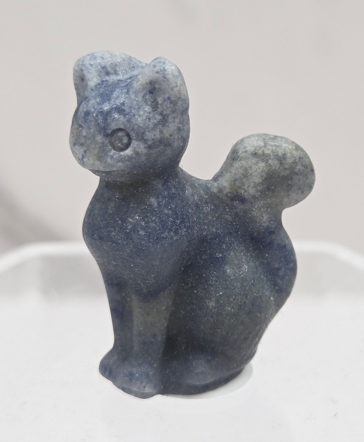 small Blue Aventurine sculpture of a cat against a neutral background