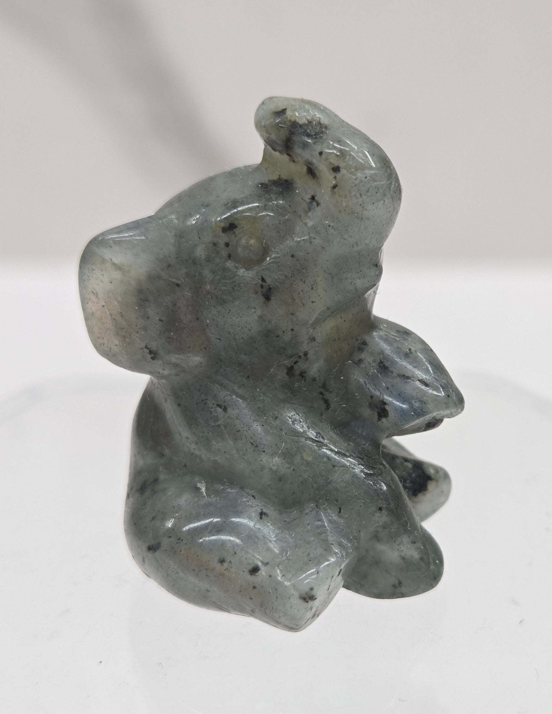 Labradorite sitting elephant carving on a white background