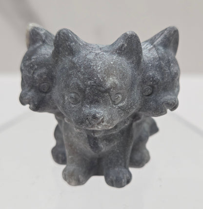 Jasper small crystal mythological cerberus animal figurines on a white surface