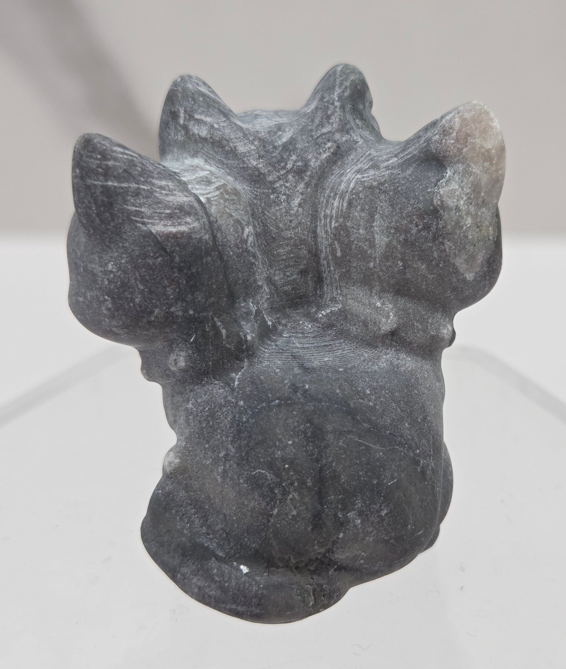 Jasper small crystal mythological cerberus animal figurines on a white surface