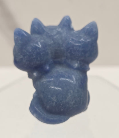 Blue Aventurine small crystal mythological cerberus animal figurines on a white surface