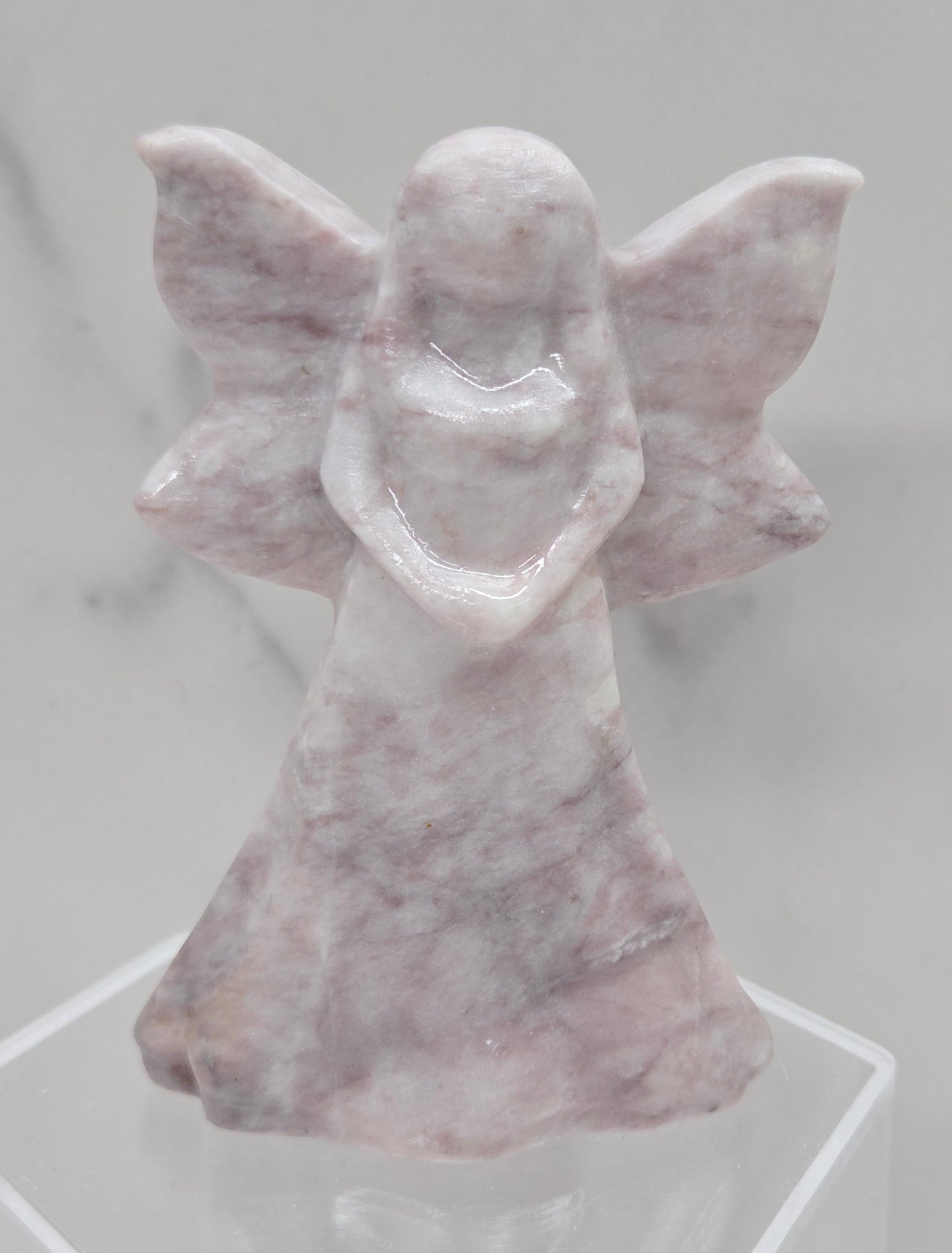Lavender Jasper fairy figurine on a white background