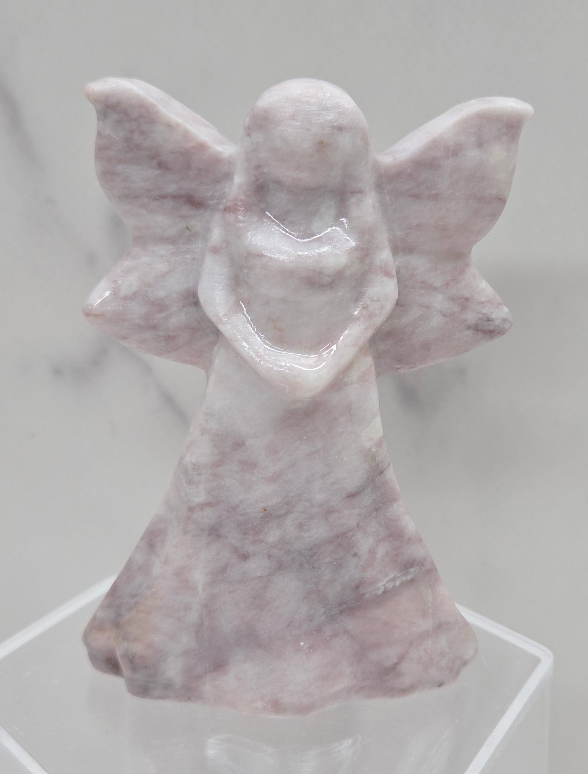 Lavender Jasper fairy figurine on a white background