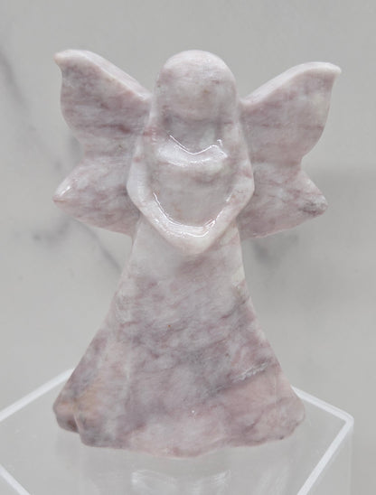 Lavender Jasper fairy figurine on a white background