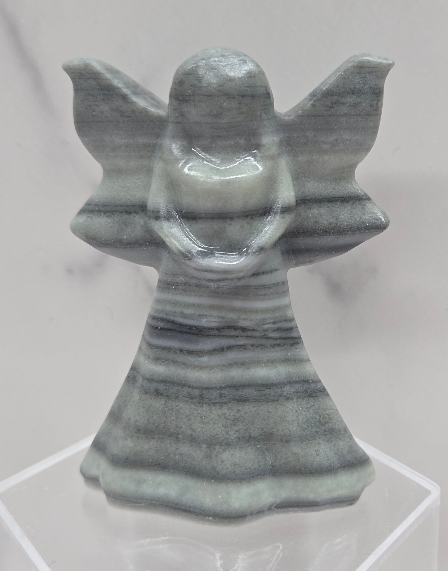 Tai Chi Jasper fairy figurine on a white background