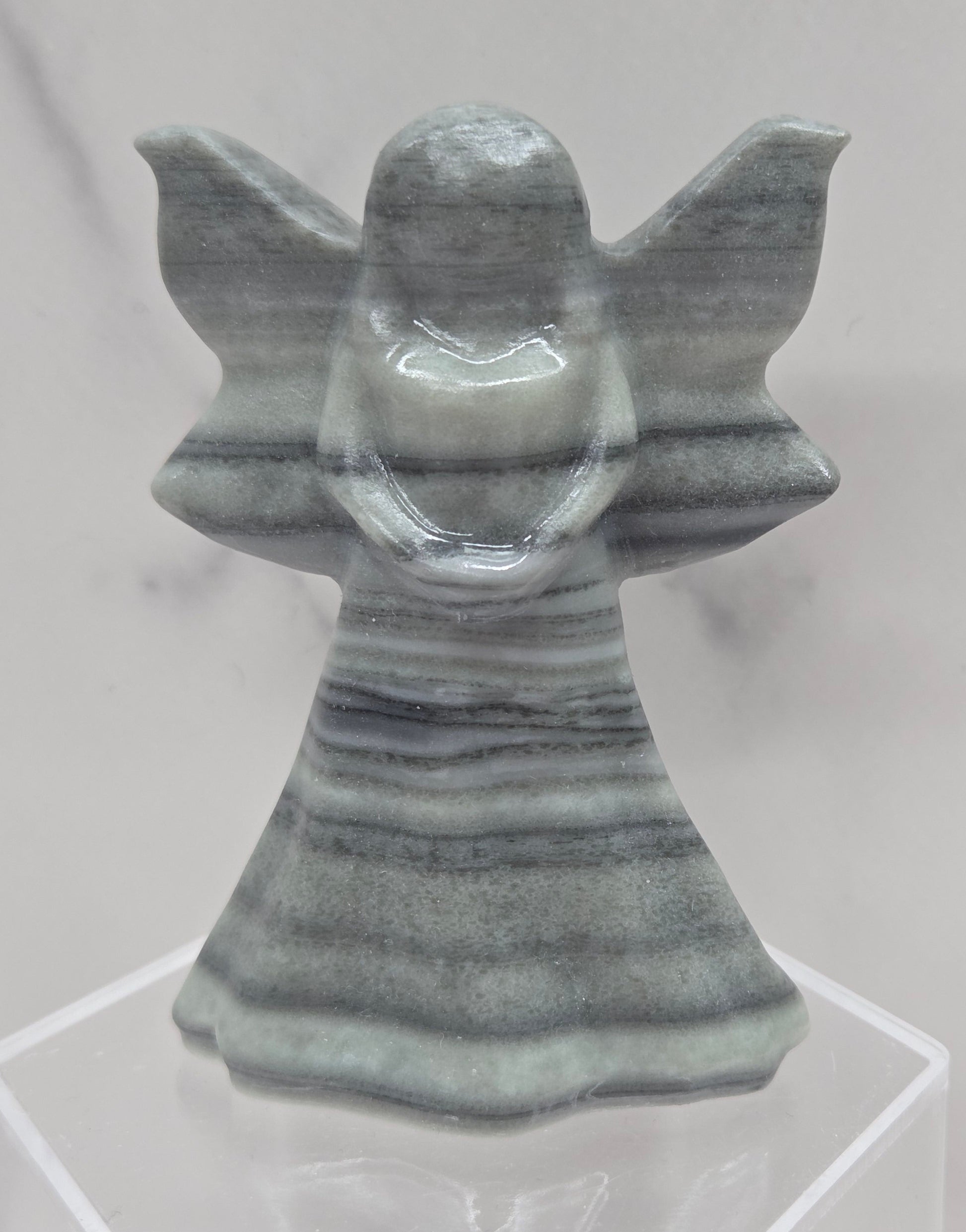 Tai Chi Jasper fairy figurine on a white background