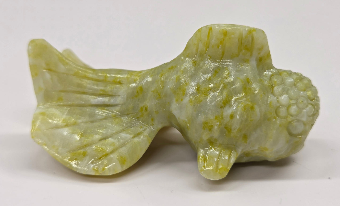 Lemon Jade fish figurine on a white background