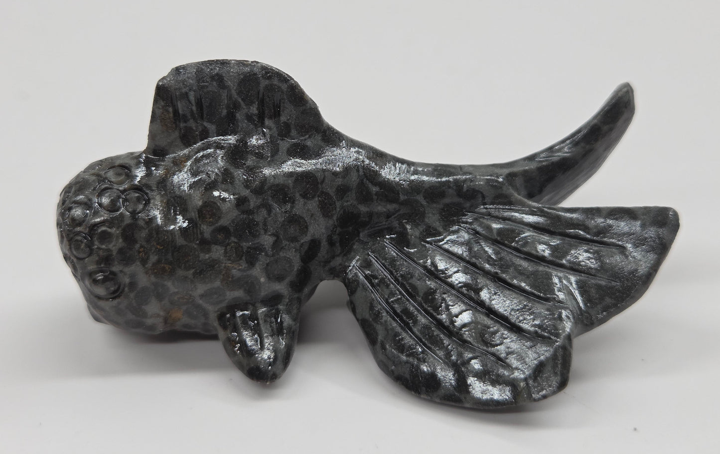 Leopard Jasper spotted fish figurine on a white background