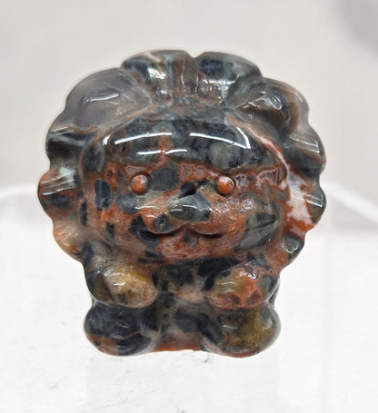 Money Agate lion carving on a white background