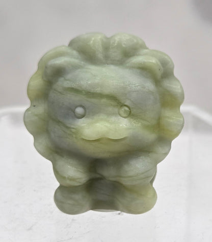 Lemon Jade lion carving on a white background