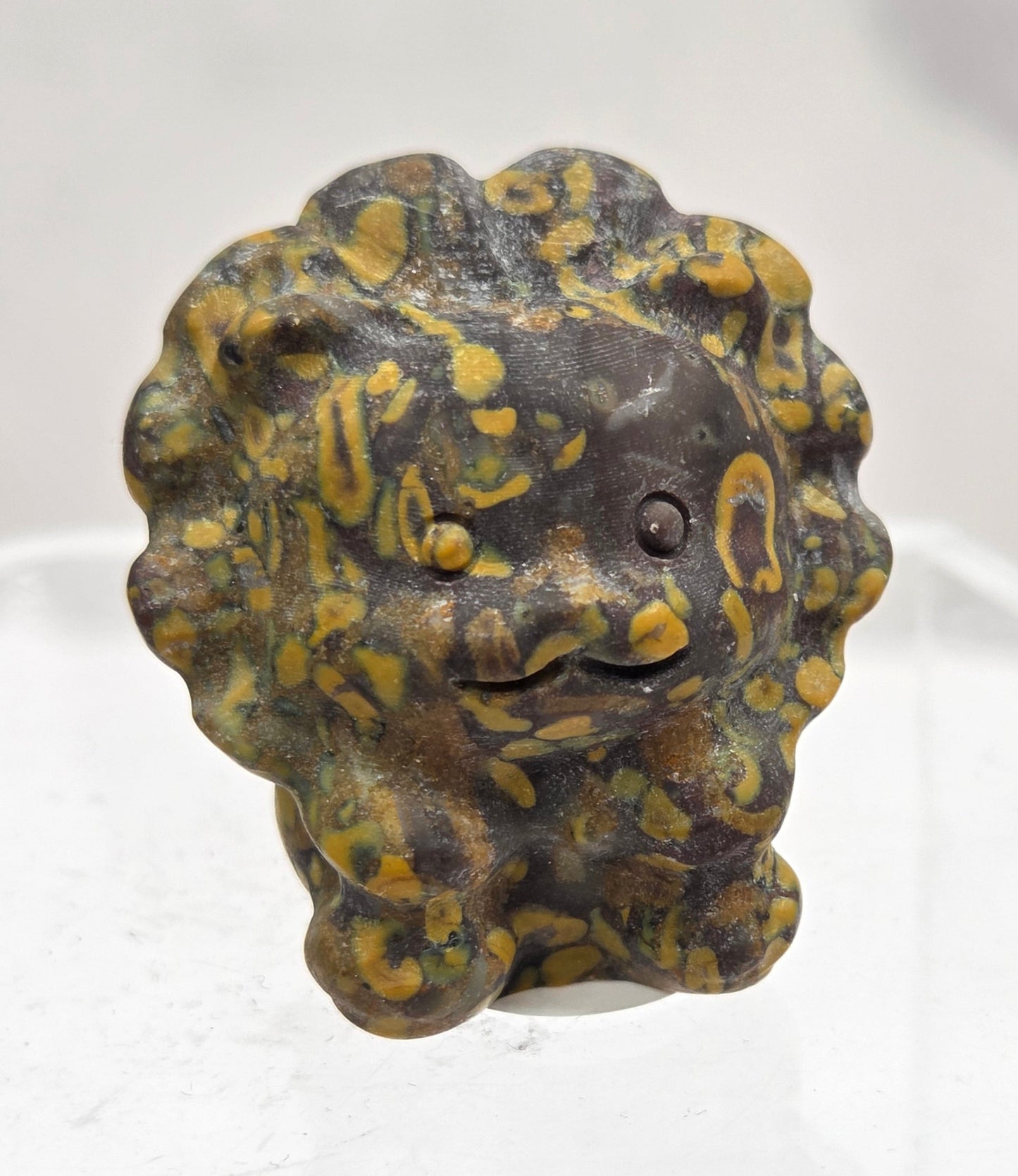 Ajooba Jasper lion carving on a white background