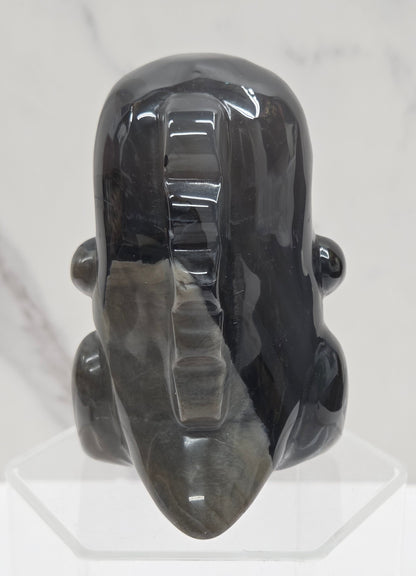 Volcano Agate cute dinosaur like carving on a white background