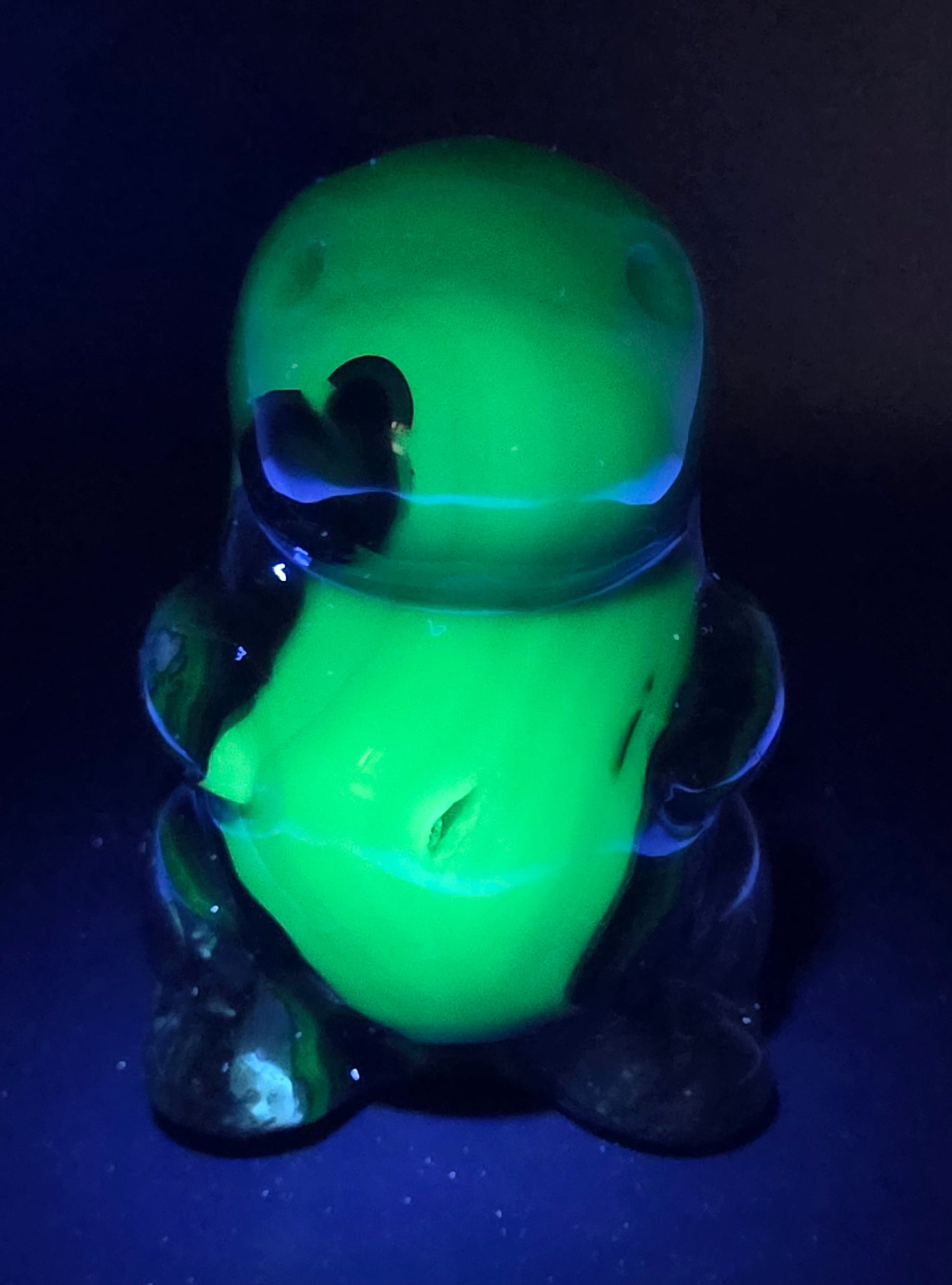 Volcano Agate cute dinosaur like carving under UV light