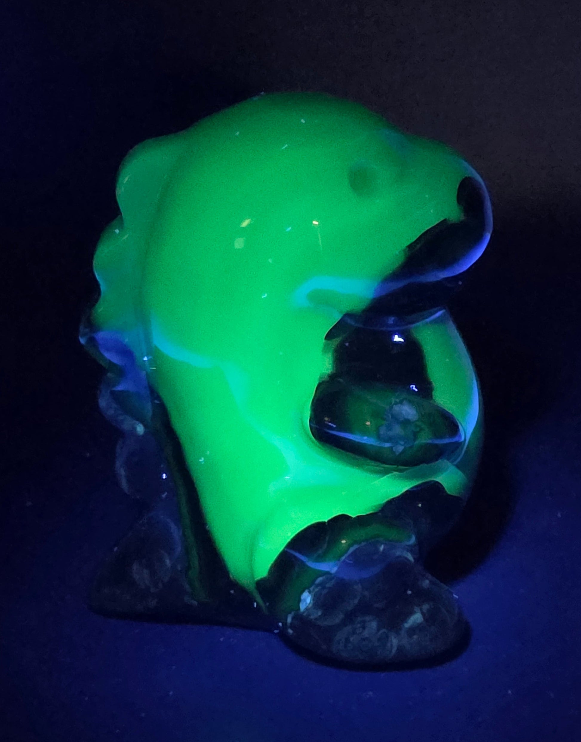 Volcano Agate cute dinosaur like carving under UV light