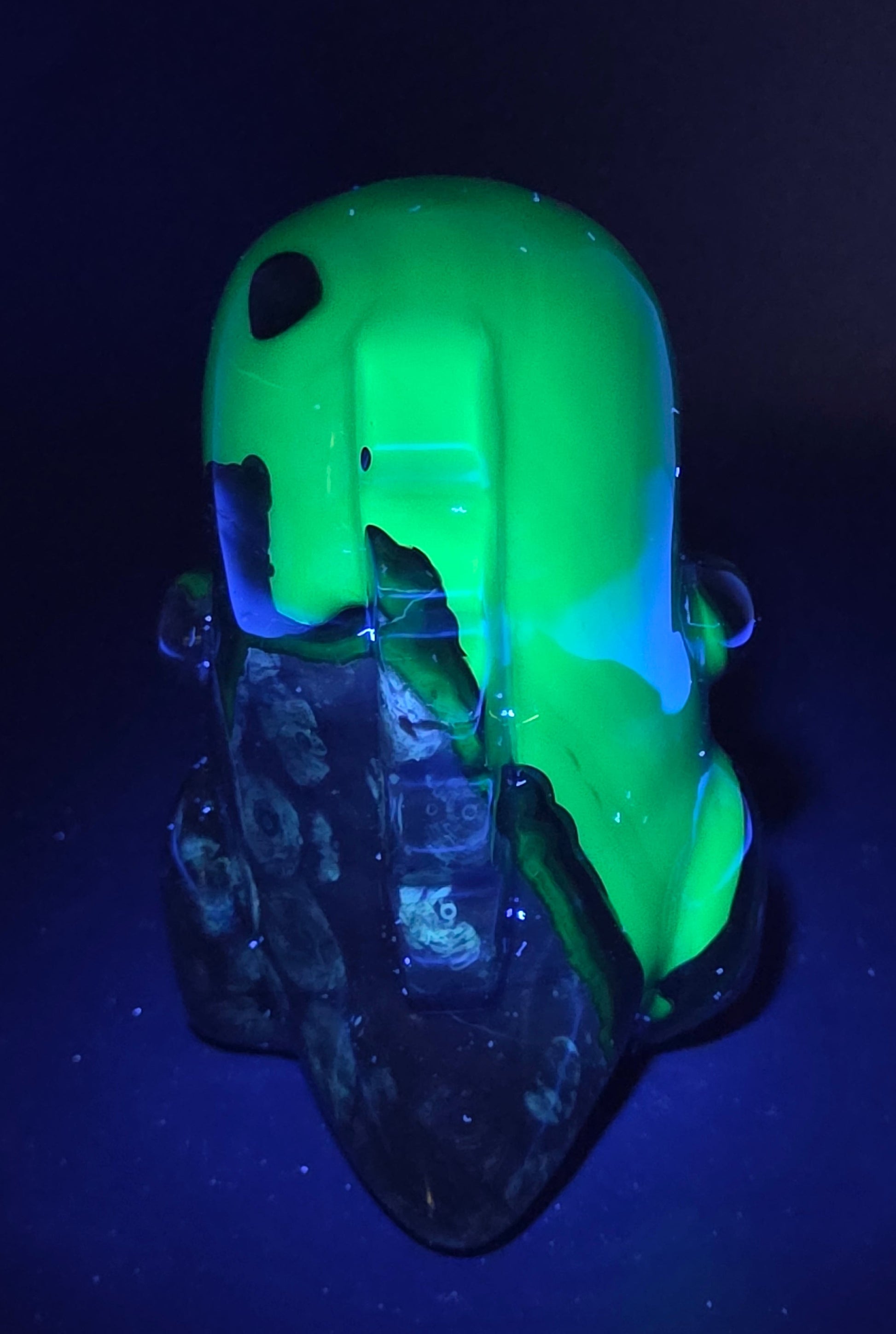 Volcano Agate cute dinosaur like carving under UV light