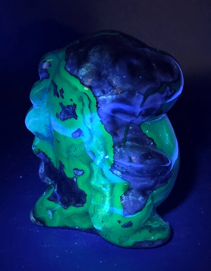 Volcano Agate cute dinosaur like carving under UV light