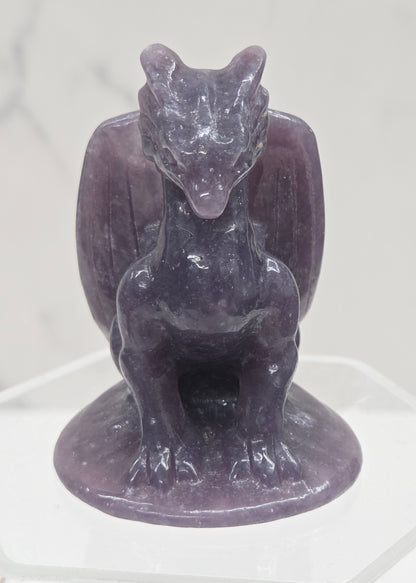 Lepidolite crystal dragon sculpture on a white background