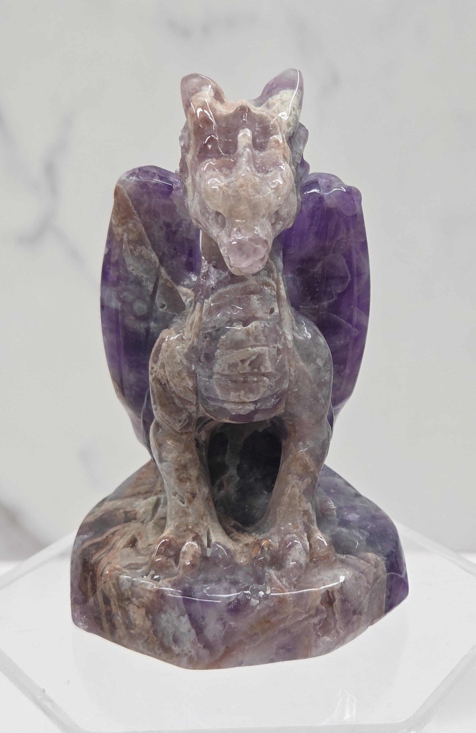 Dream Amethyst crystal dragon sculpture on a white background