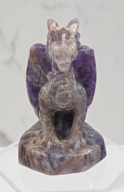 Dream Amethyst crystal dragon sculpture on a white background