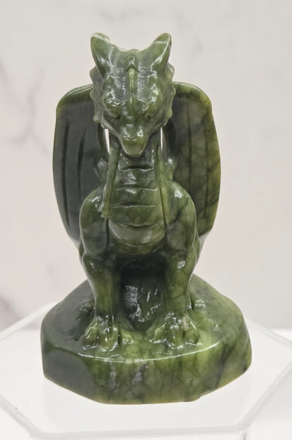 Green Jade sculpture of a dragon on a white background