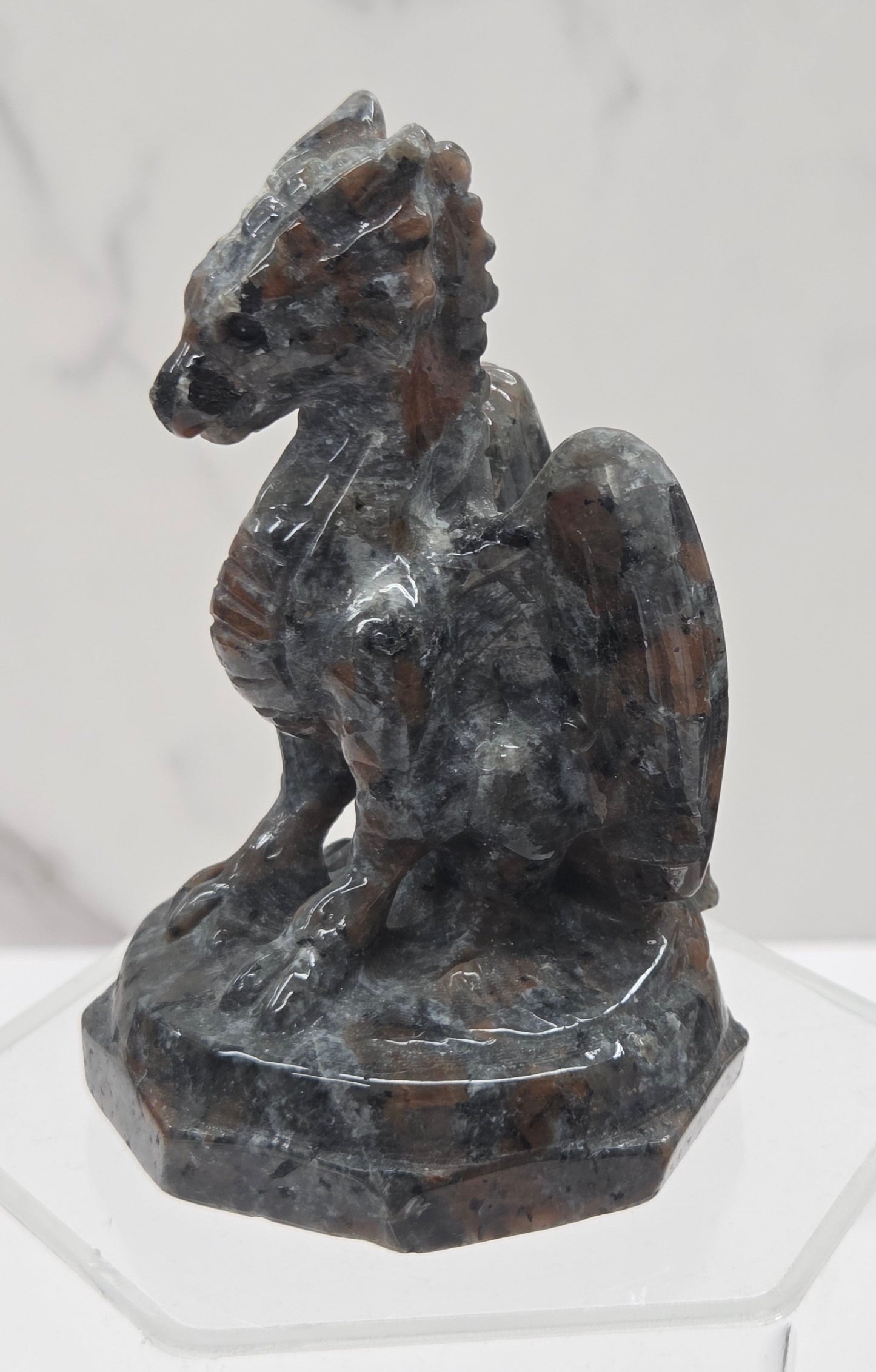 Yooperlite crystal dragon sculpture on a white background