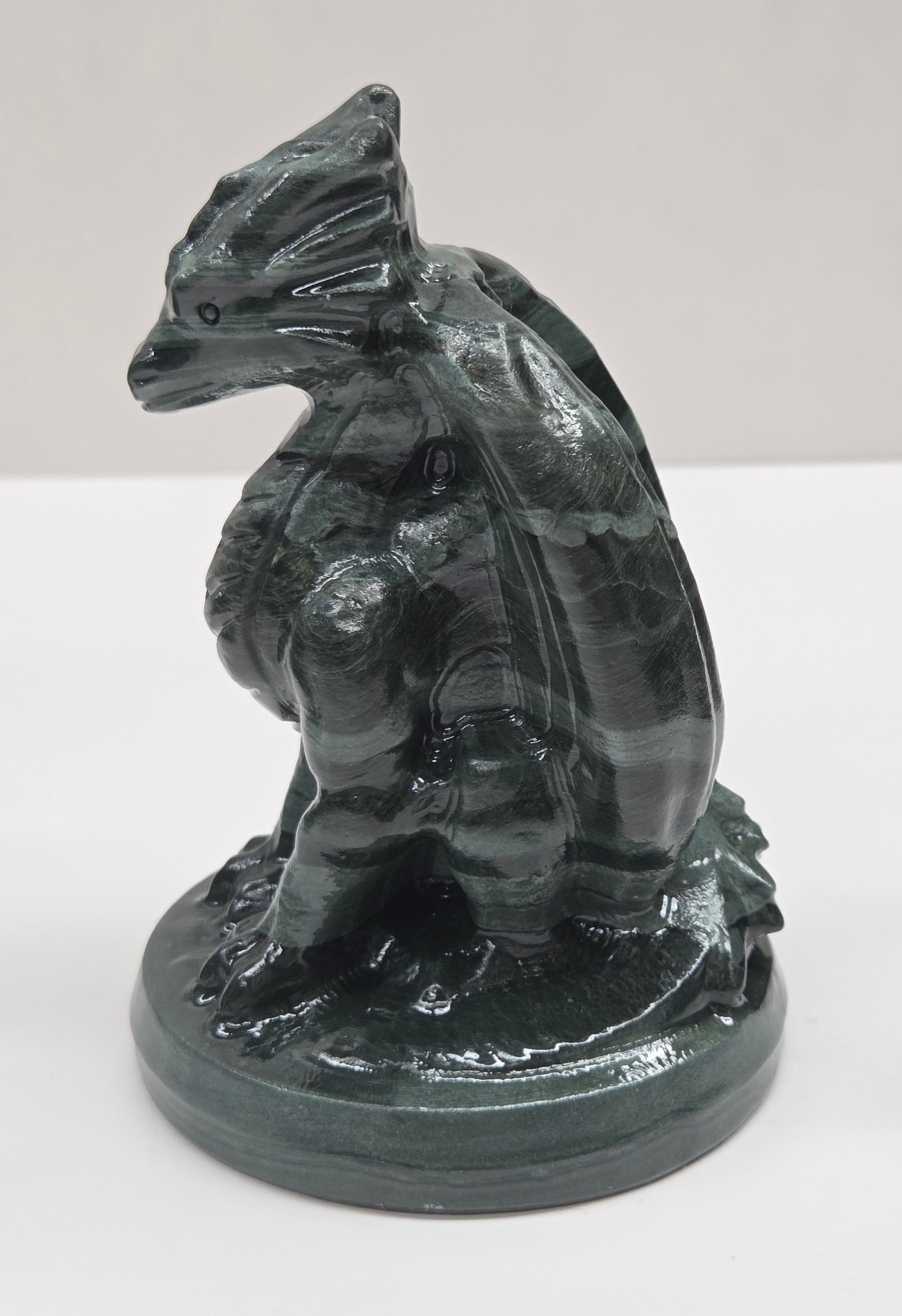 Green Wave Picture Jasper crystal dragon sculpture on a white background