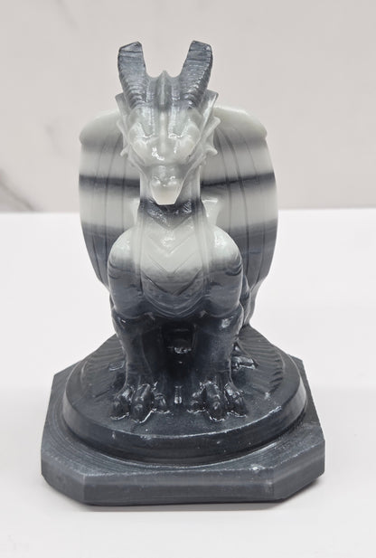 Tai Chi Jasper crystal dragon sculpture on a white background