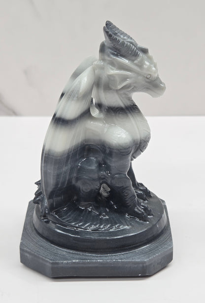 Tai Chi Jasper crystal dragon sculpture on a white background