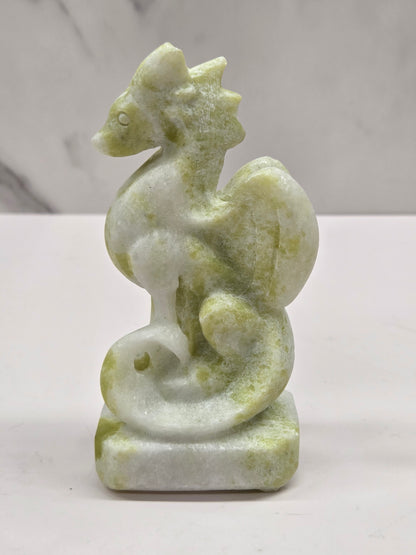Lemon Jade crystal dragon sculpture on a white background