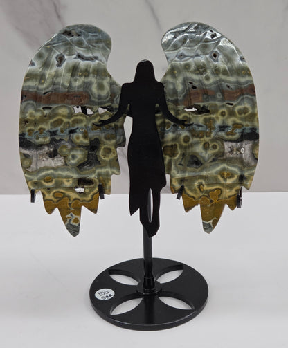 Multi-colored and patterned Jasper angel wings on a black stand against a white background